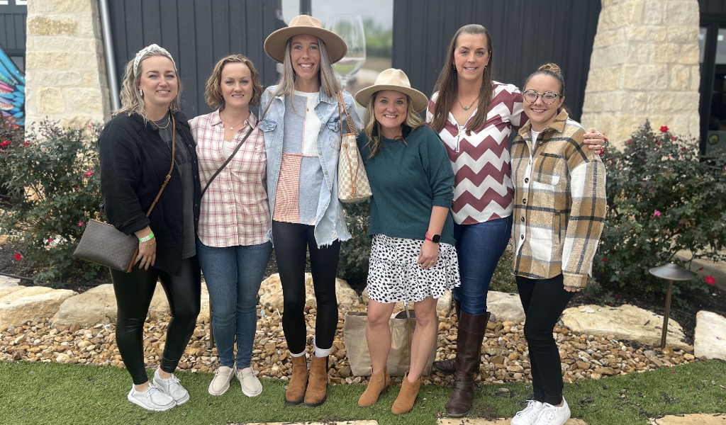 a group of six women on a wine tour in Fredericksburg, Texas