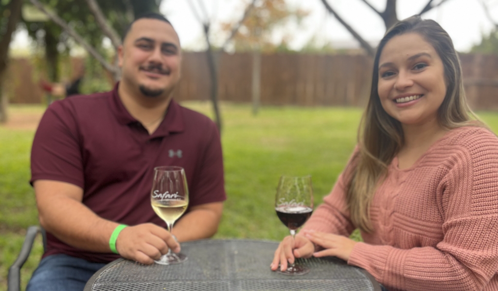 a man and a woman enjoying wine at Safari Winery in Fredericksburg, TX