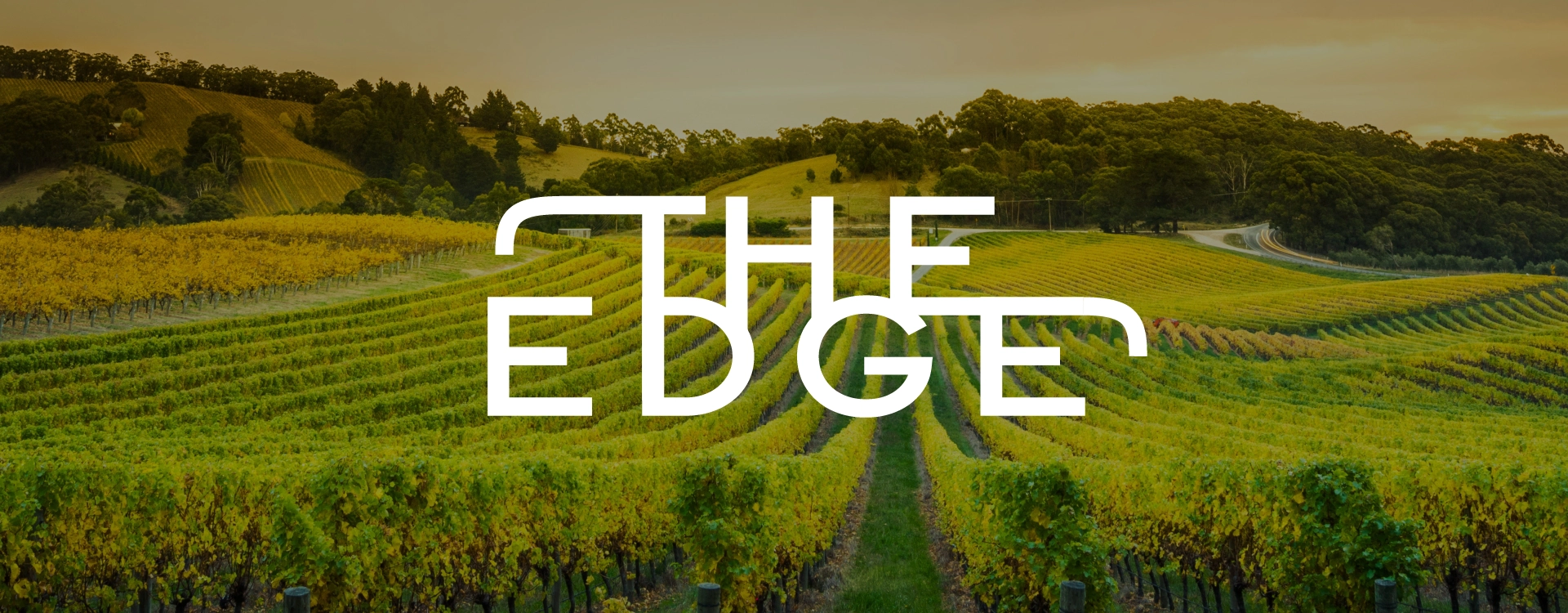 The Edge Tasting Room and Restaurant logo overlaid on photo of the Texas Hill Country.