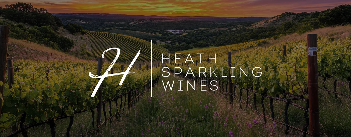 Logo of Heath Sparkling Wines overlaid on a photo of a vineyard.