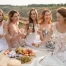 Girls drinking wine on a picnic in wine country.
