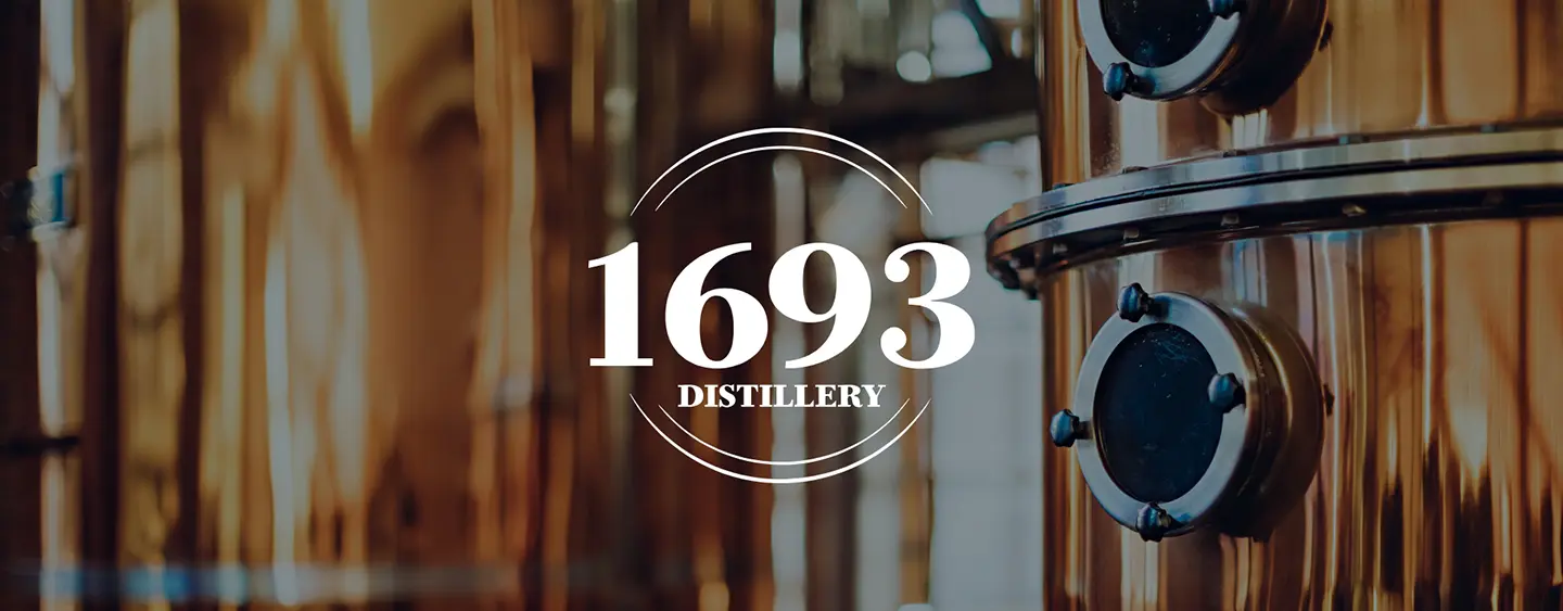 1693 Distillery logo overlaid on a photo of a still.